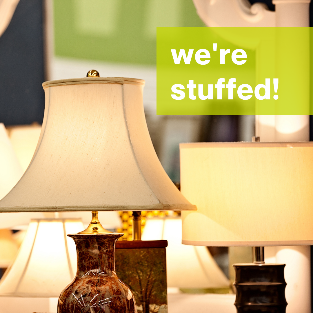 A picture of multiple lamps that are on and above them is a green box with white letters saying 'we're stuffed'
