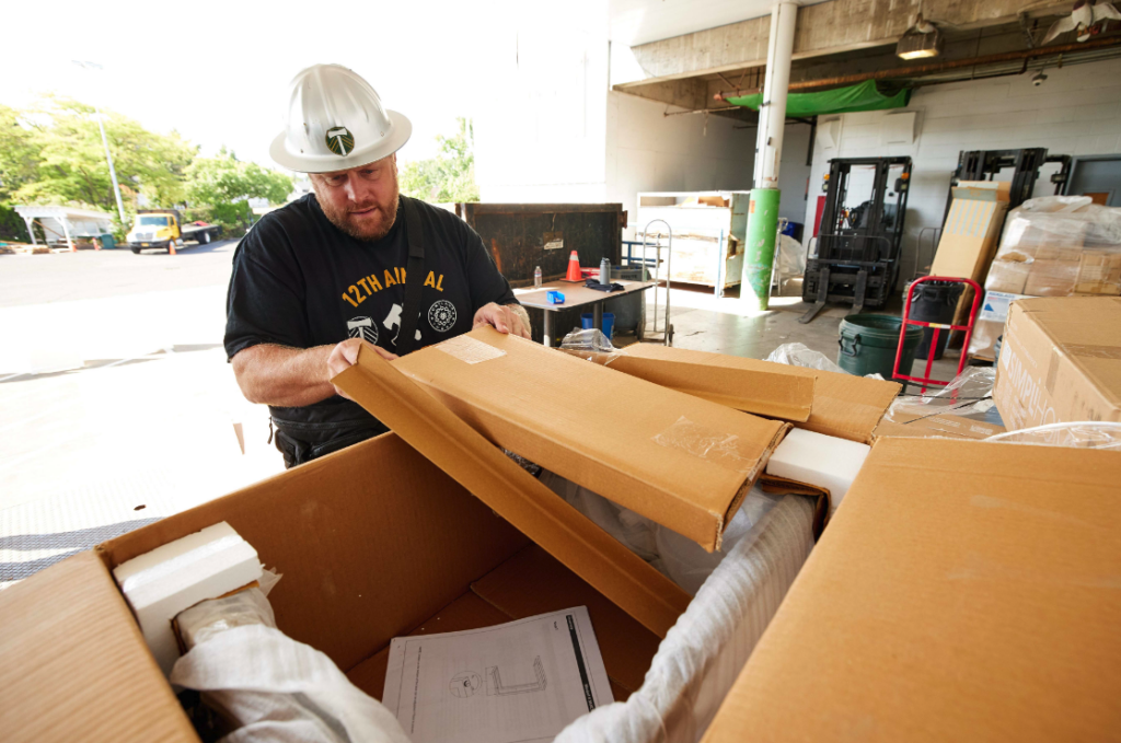 Volunteer Portland Thorns FC and the Portland Timbers FC helps recycle cardboard