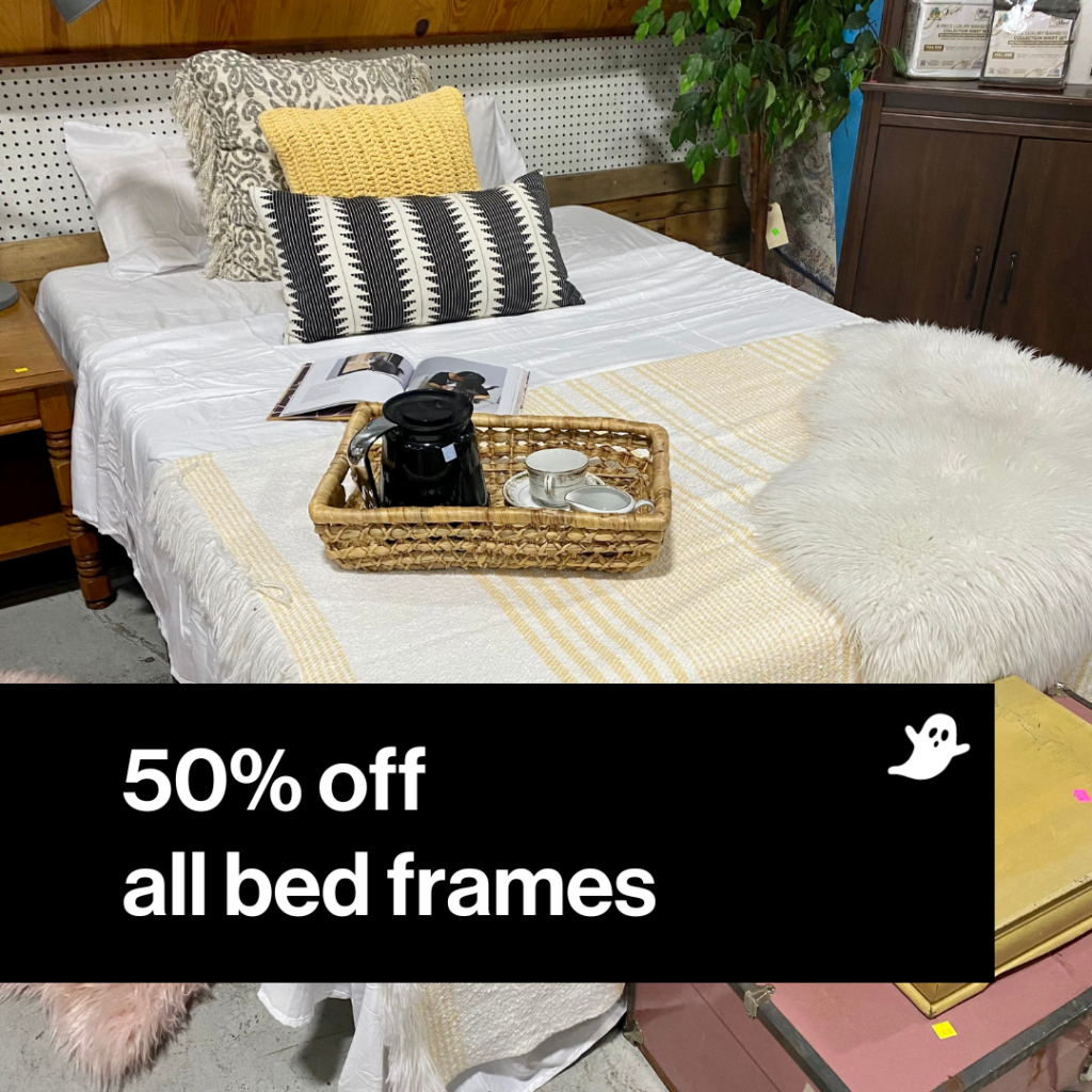 Image of bed and pillows with 50% off all bed frames in black box